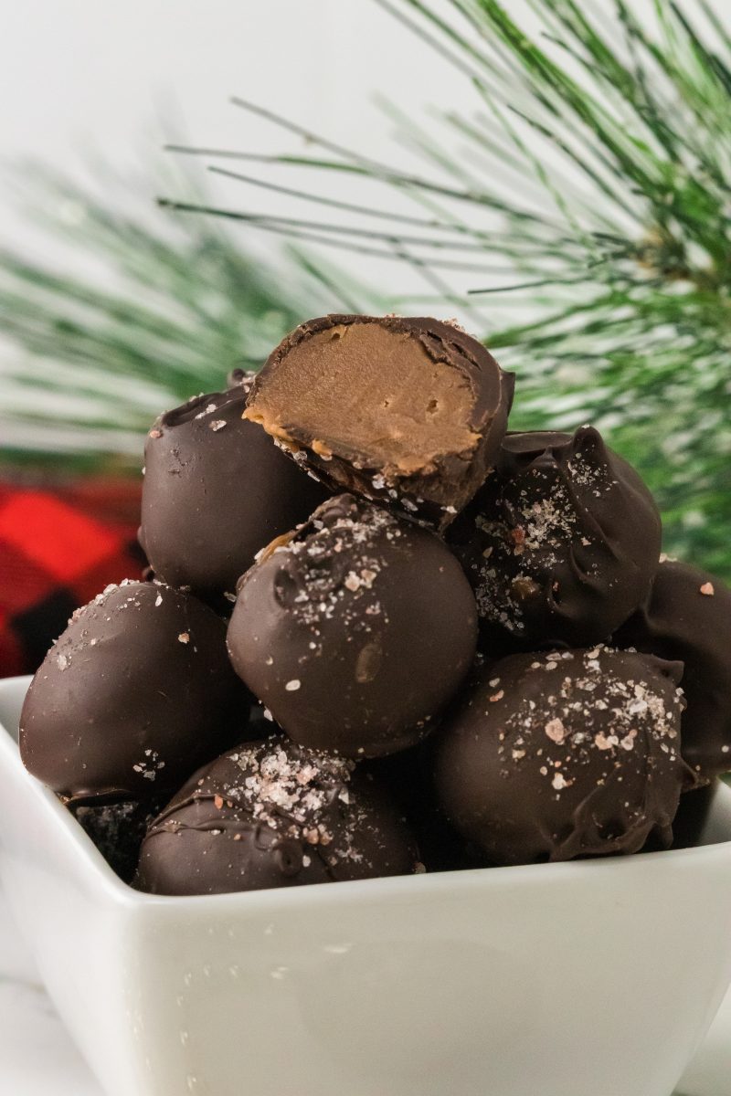 side view of caramel truffles in a pile.