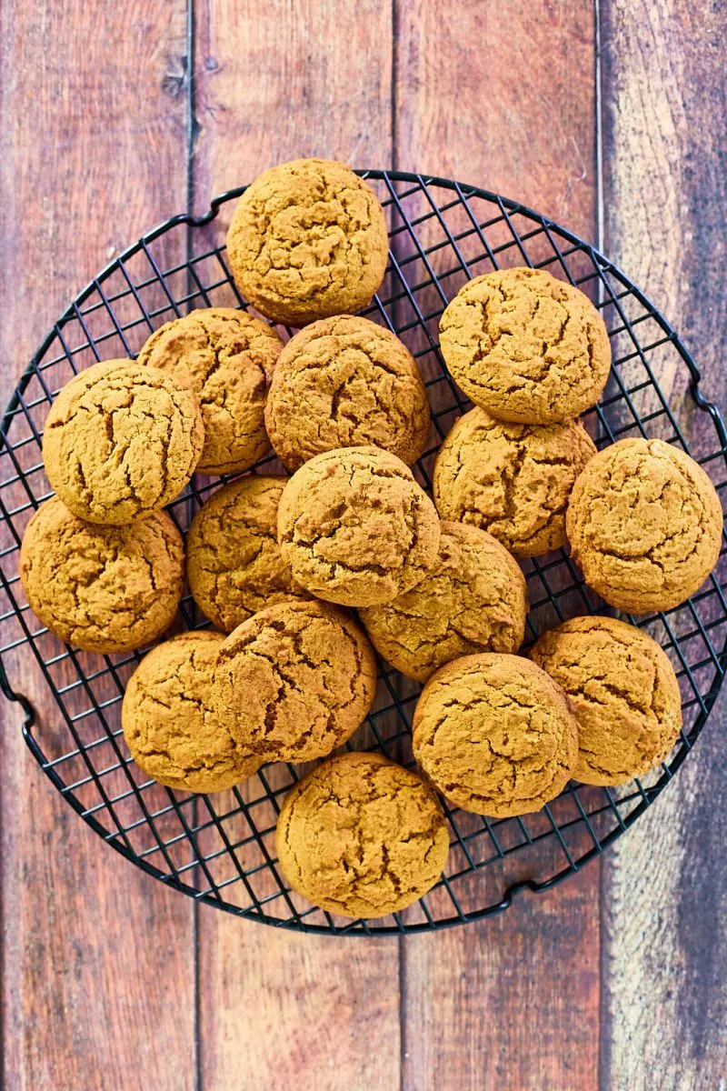 Top down view of ginger cookies on a wire cooling rack.