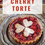 Close up view of an individual tart filled with bright red cherry filling on a metal plate. The title "Sweet Cherry Torte" is at the top of the image for Pinterest. Hostess At Heart