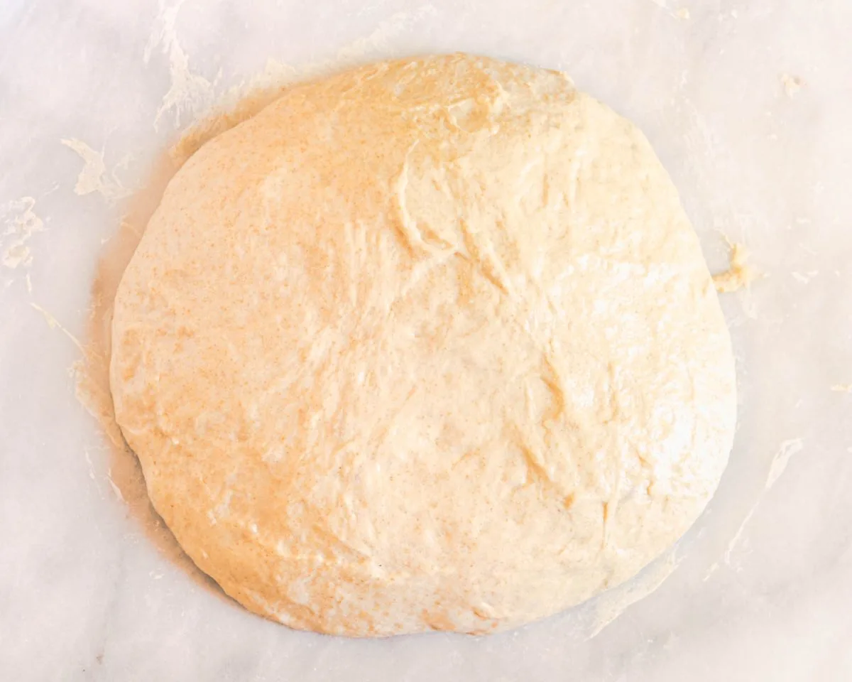 Bread dough sitting on a marble slab before shaping - Hostess At Heart