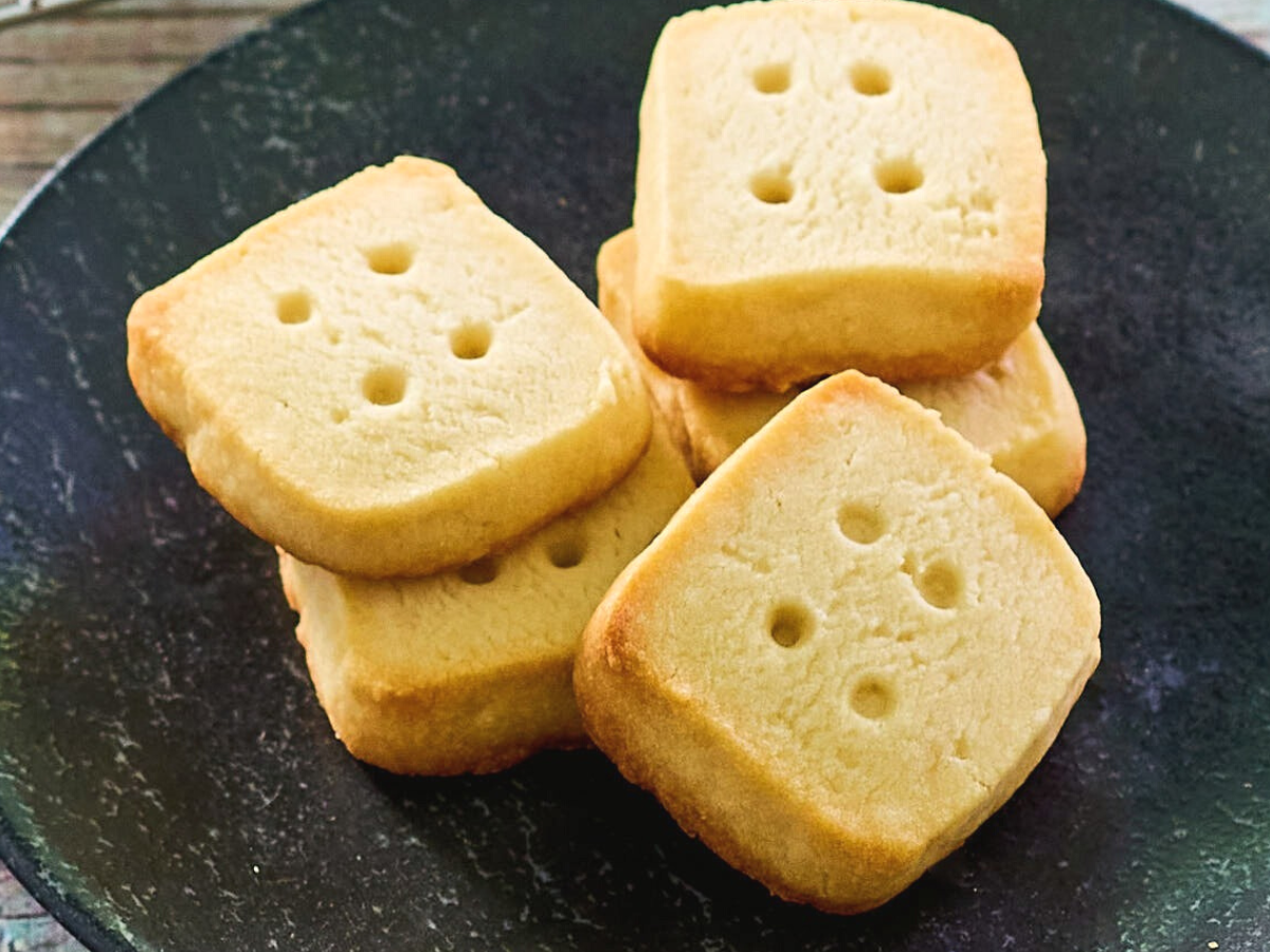 A closeup image of Christmas Short Bread Cookies on a plate - Hostess At Heart