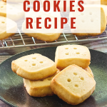 A stack of shortbread cookies that look like dice sitting on a plate. The title is on the photo for Pinterest - Hostess At Heart