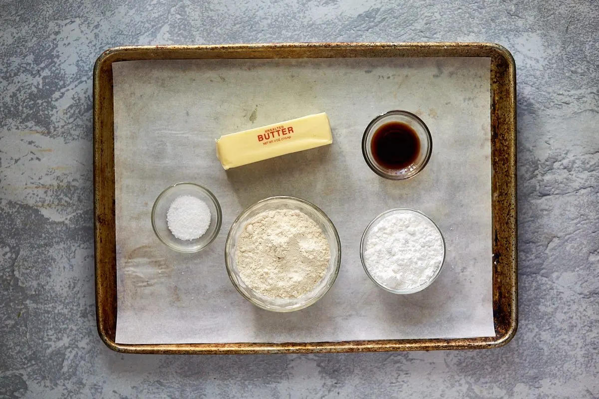 Butter, salt, flour, sugar and vanilla on a baking sheet. Hostess At Heart