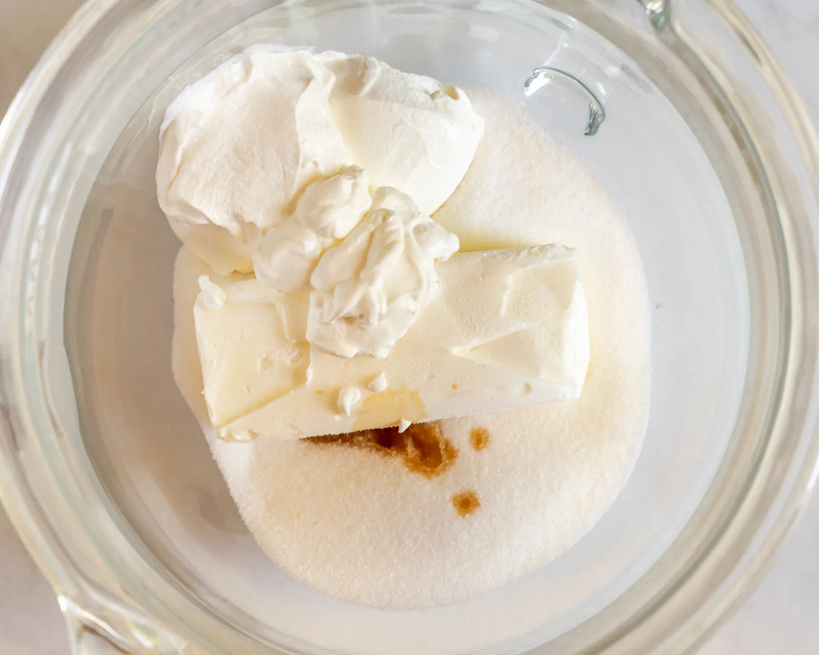 Creamy ingredients used in the sour cream sugar recipe in a bowl - hostess at heart