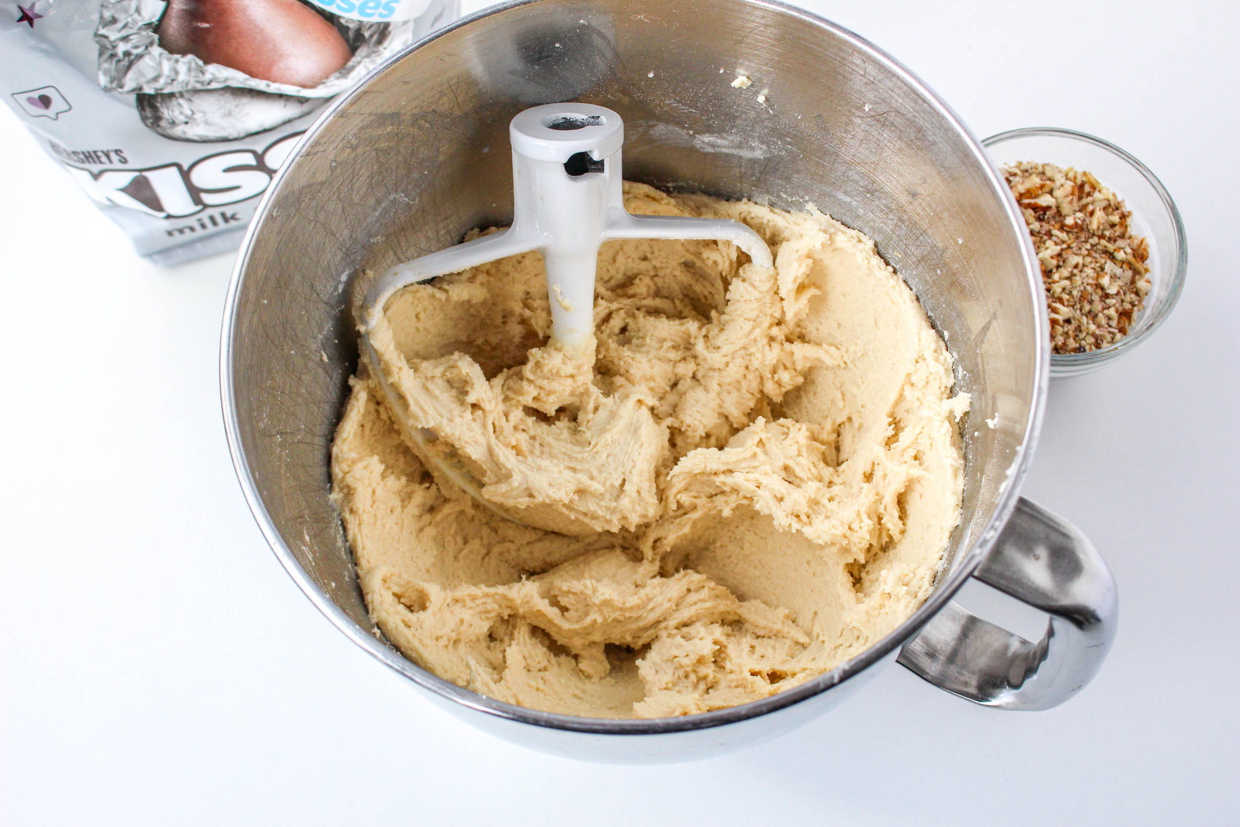 A mixing bowl filled with thick cookie batter. Hostess At Heart
