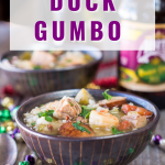 Side view of cajun duck gumbo loaded with shrimp and andouille sausage.