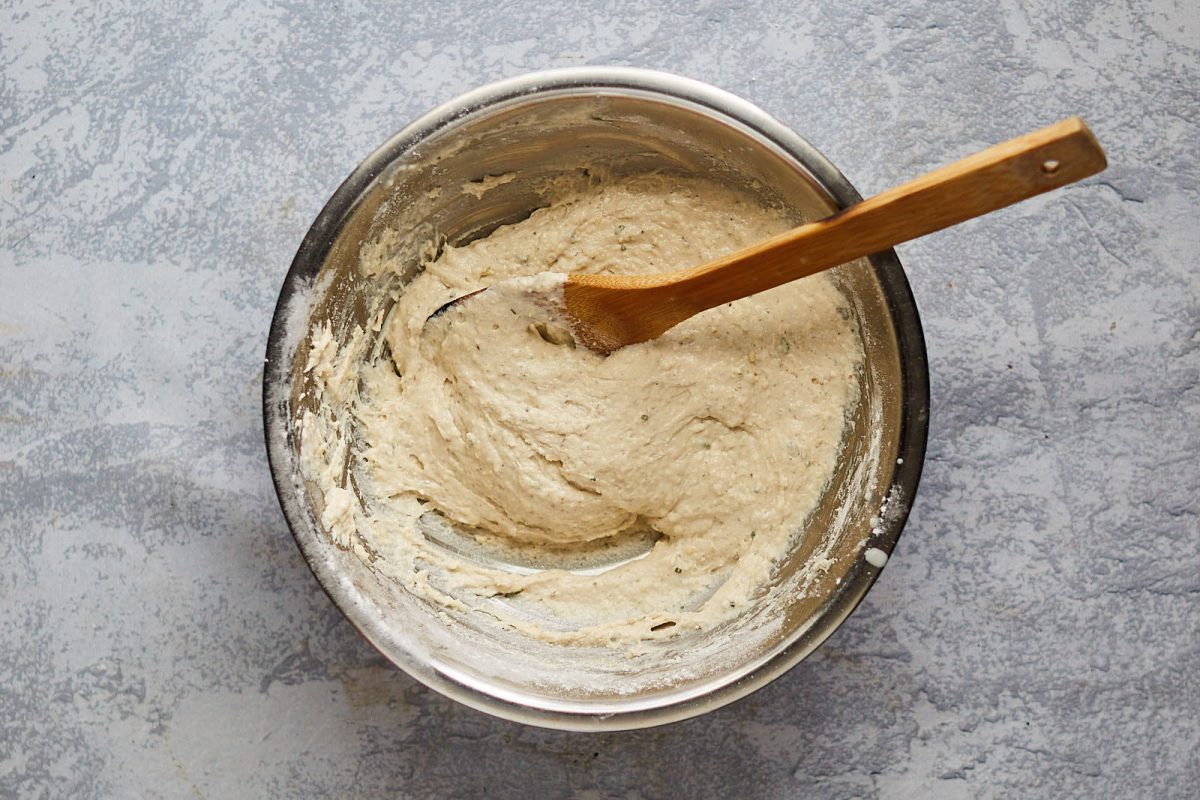 Dough ingredients mixed together with a wooden spoon. Hostess At Heart