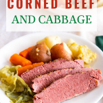 Angled view of a serving of instant pot corned beef and cabbage sitting on a dinner plate. - Hostess At Heart
