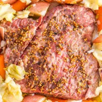 Top down view of a instant pot Corned Beef and Cabbage on a platter. Hostess At Heart