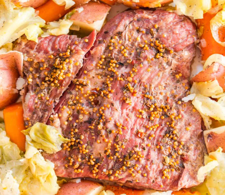 Top down view of a instant pot Corned Beef and Cabbage on a platter. Hostess At Heart