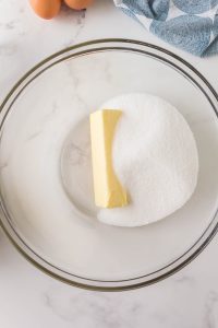 Sugar and a stick of butter in a glass bowl - Hostess At Heart