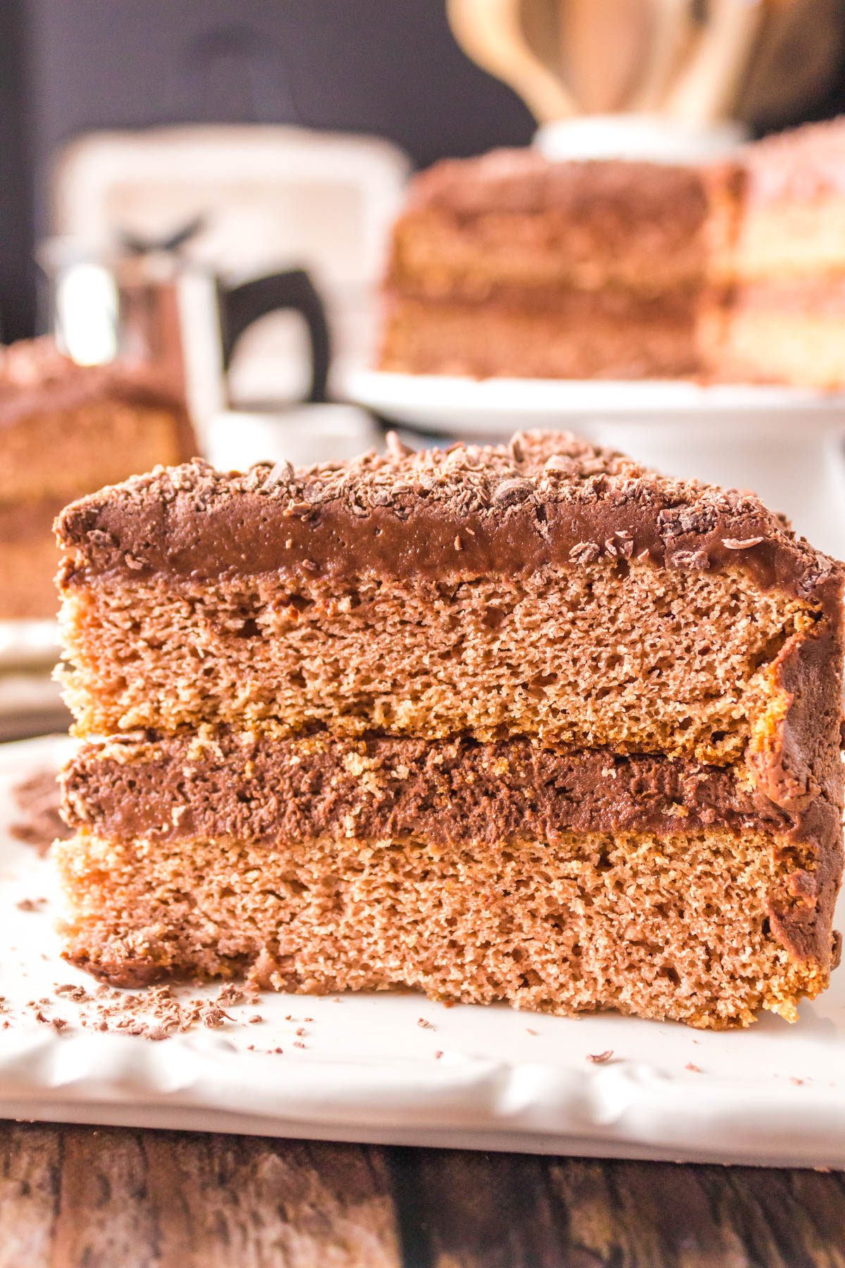 Close side view of a slice of Chocolate Layer Mahogany Cake - Hostess At Heart