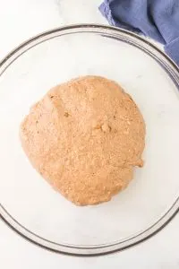 A ball of dough in a glass bowl. Hostess At Heart