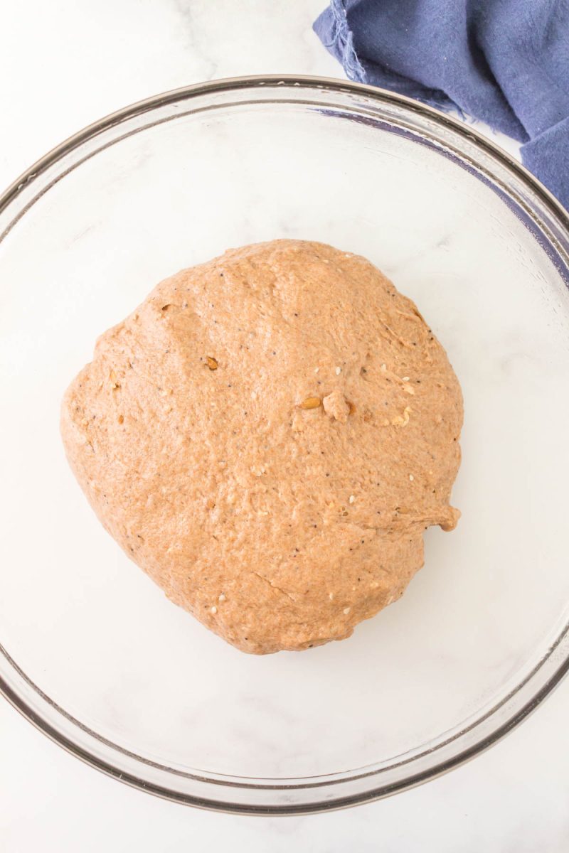 A ball of dough in a glass bowl. Hostess At Heart