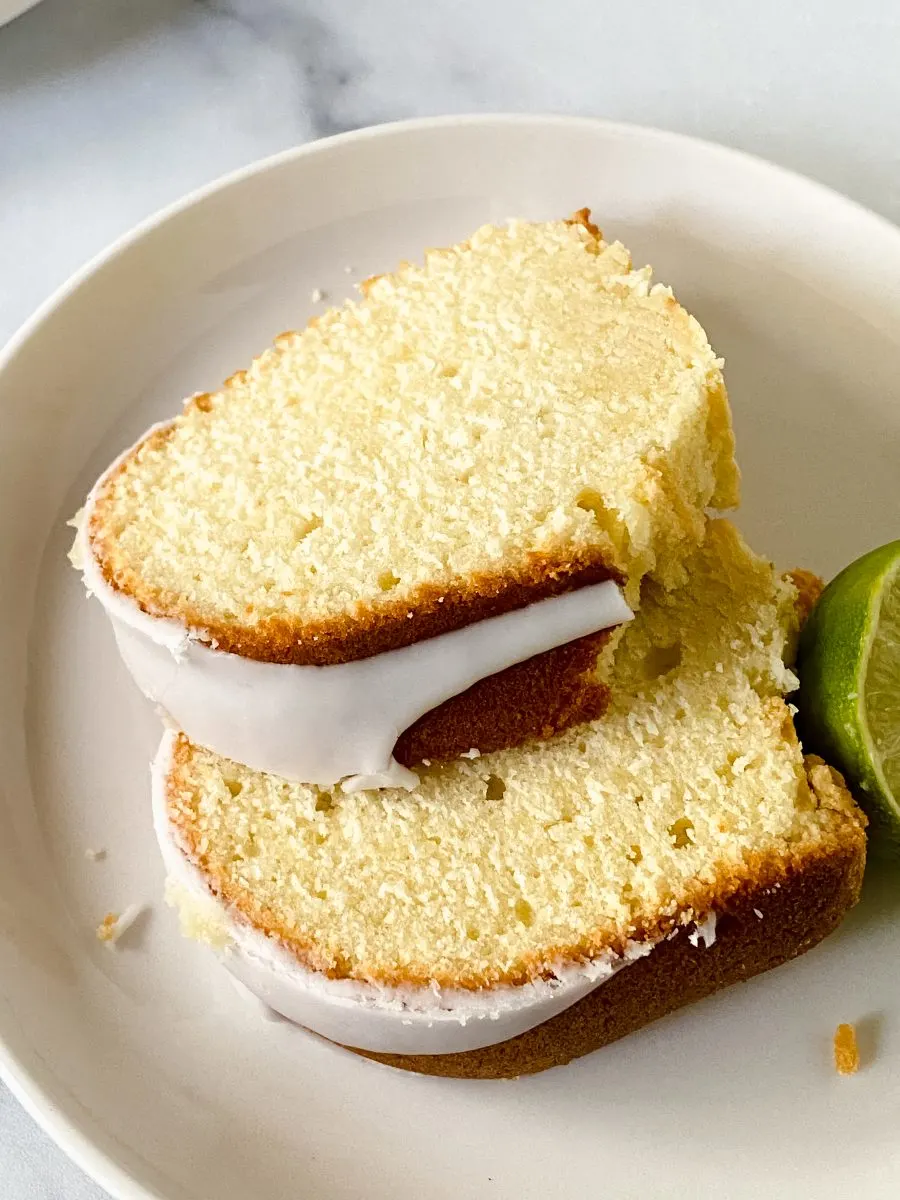 Angled view of keylime bundt cake slices topped with glaze - Hostess At Heart