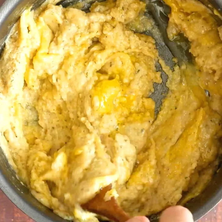 Egg added to a pan of Jewish Popover batter - Hostess At Heart