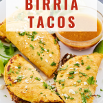 Top down view of beef tacos sitting on a plate garnished with chopped cilantro and cheese.