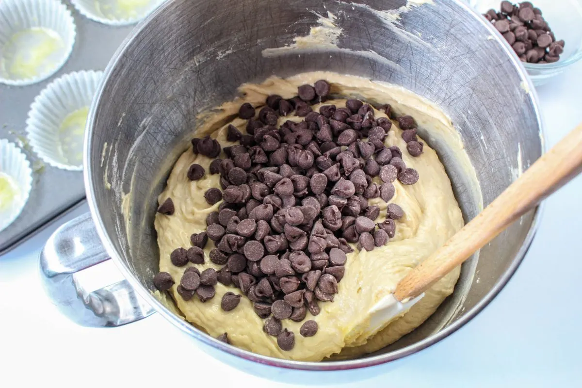 Chocolate chips added to Peanut Butter Banana Muffin Batter - Hostess At Heart