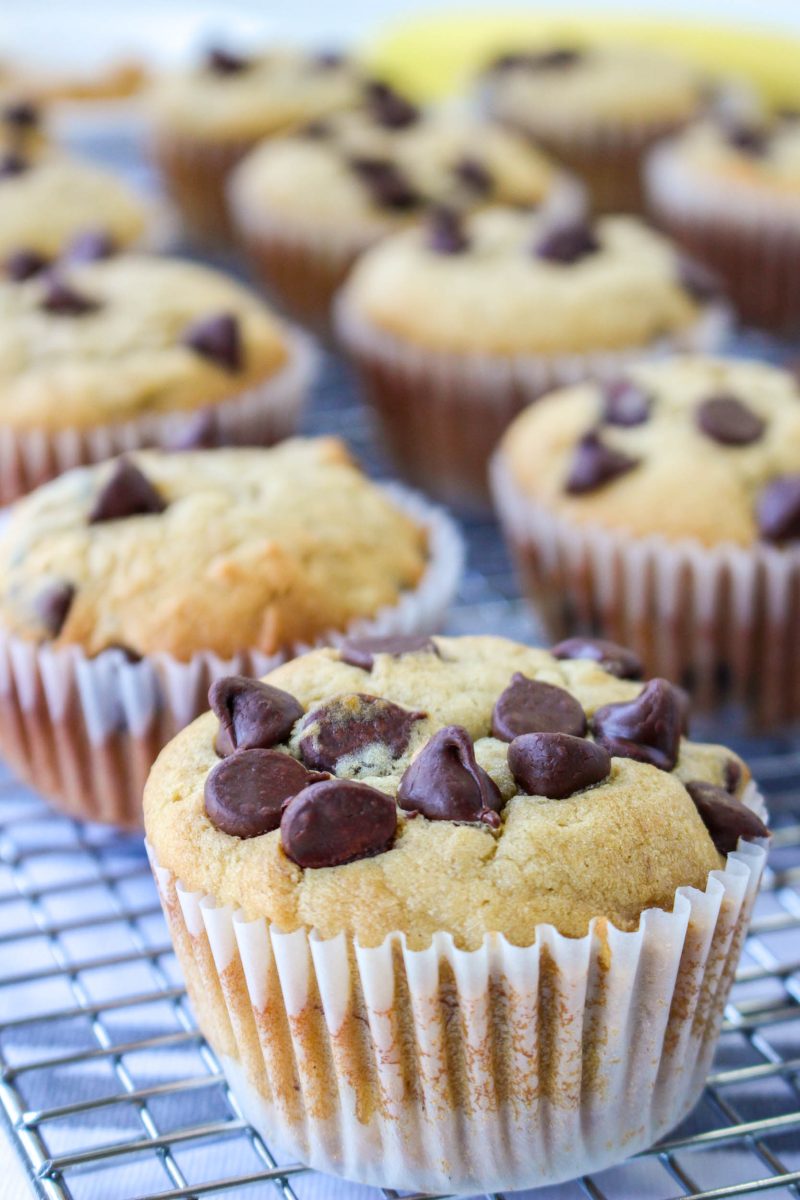 Close-up image of a Chocolate Banana Peanut Butter Muffin sitting on a cooling rack. Hostess At Heart