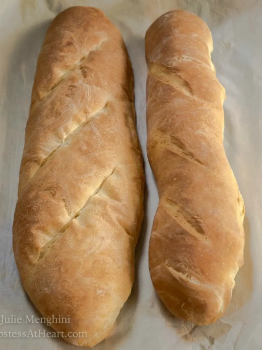 Two loaves of bread showing the difference between French and Italian bread.