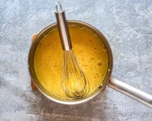 Top down view of a custard cooking in a saucepan - Hostess At Heart