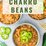 Top-down view of a bowl of cooked charros beans topped with sliced jalapenos - Hostess At Heart