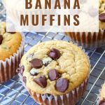 Angled view of a muffin topped with chocolate chips on a cooling rack - Hostess At Heart