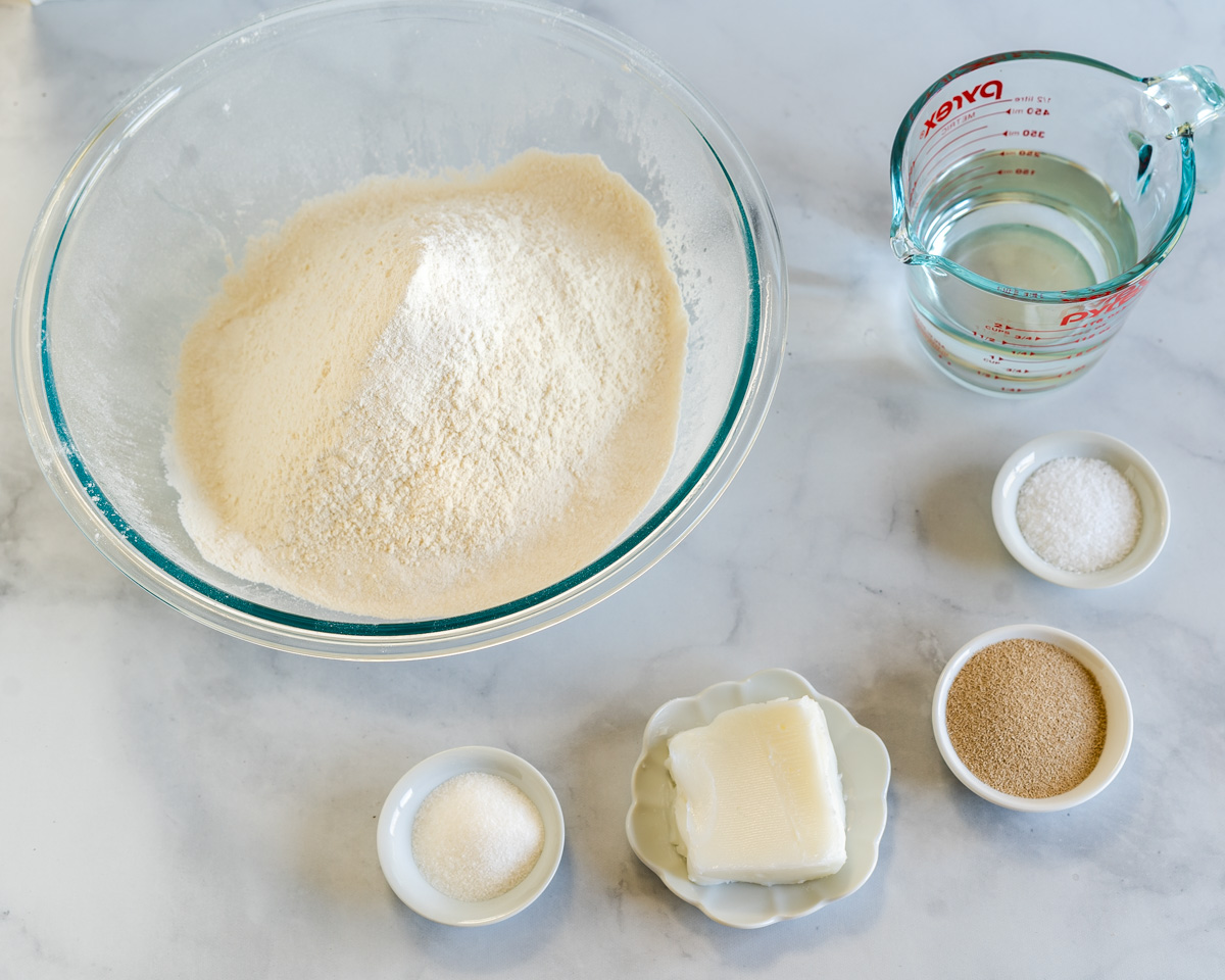 Ingredients used to make Cuban Bread including flour, yeast, salt, lard, and water.