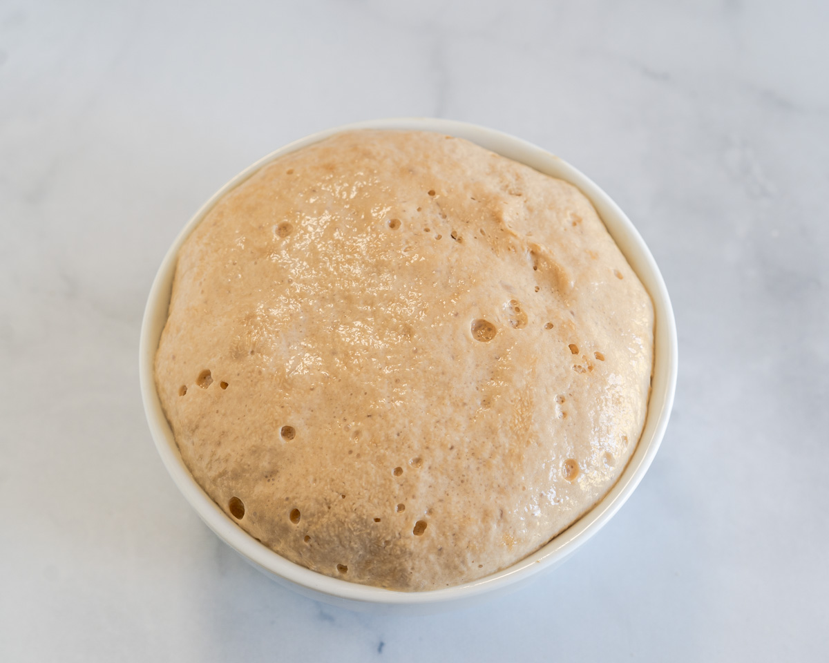 A small dish holding activated bubbly yeast