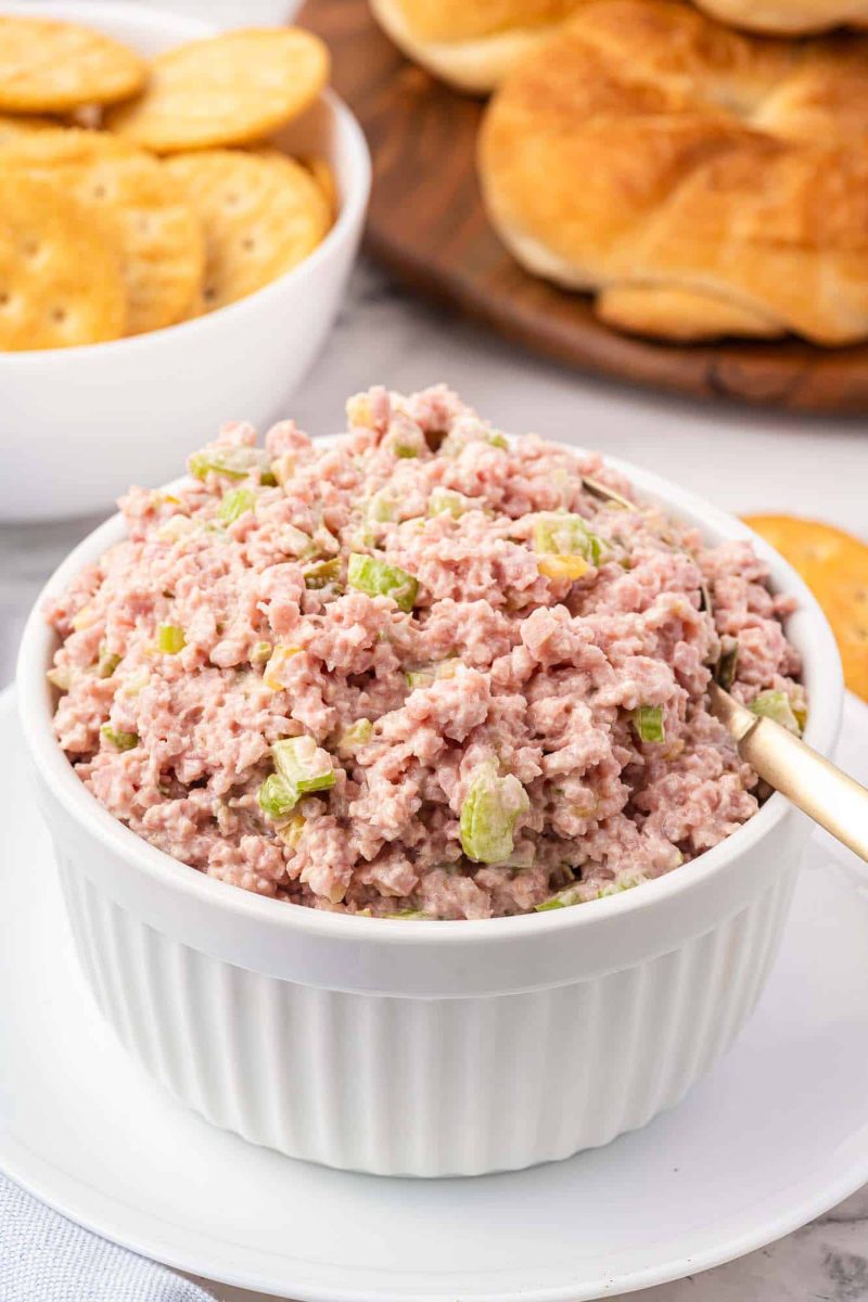 A bowl filled with chopped ham sandwich filling.