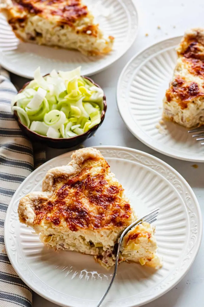 Sideview of plates holding slices of quiche.