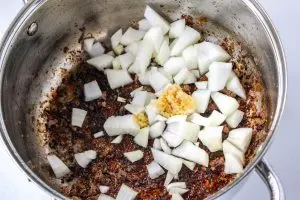 Diced onion and minced garlic sauteed in a skillet