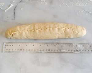 Bread dough shaped into a baguette 12 inches long - Hostess At Heart
