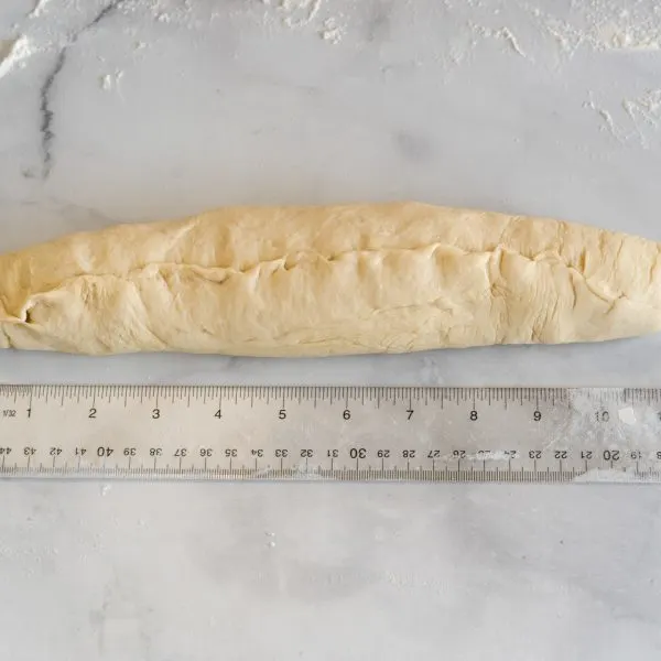 Bread dough shaped into a baguette 12 inches long - Hostess At Heart