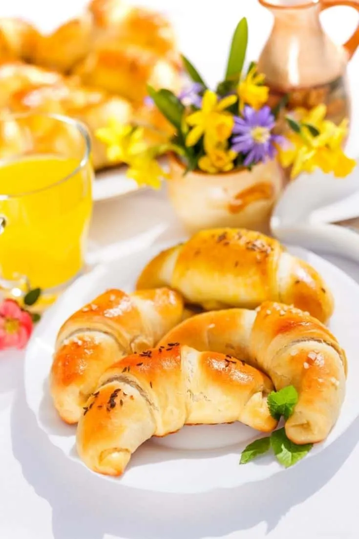 Baked crescent rolls on a plate.