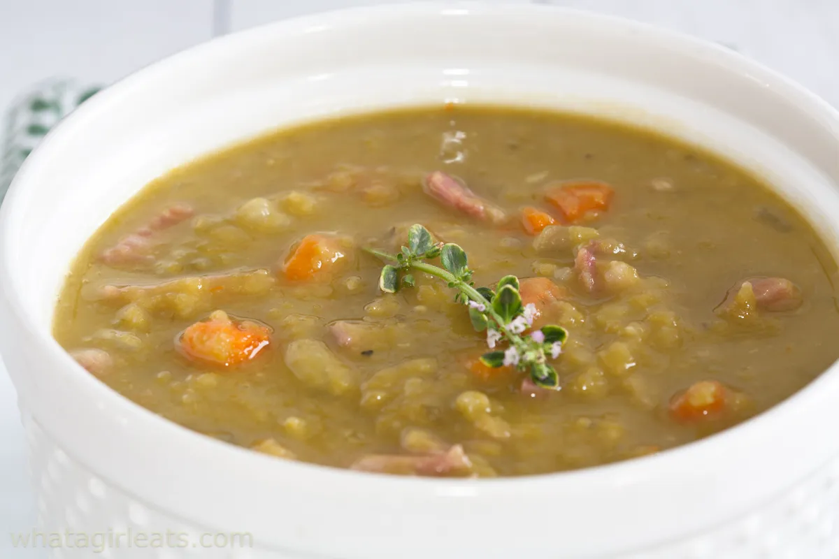 Sideview of a bowl of split pea and ham soup 