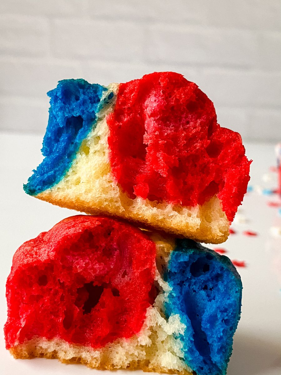 Unfrosted cupcake colored with red, white, and blue batter for the fourth of july broken in half and stacked together - Hostess At Heart