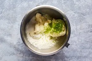 Top down view of key lime cheesecake filling ingredients in a mixing bowl - Hostess At Heart