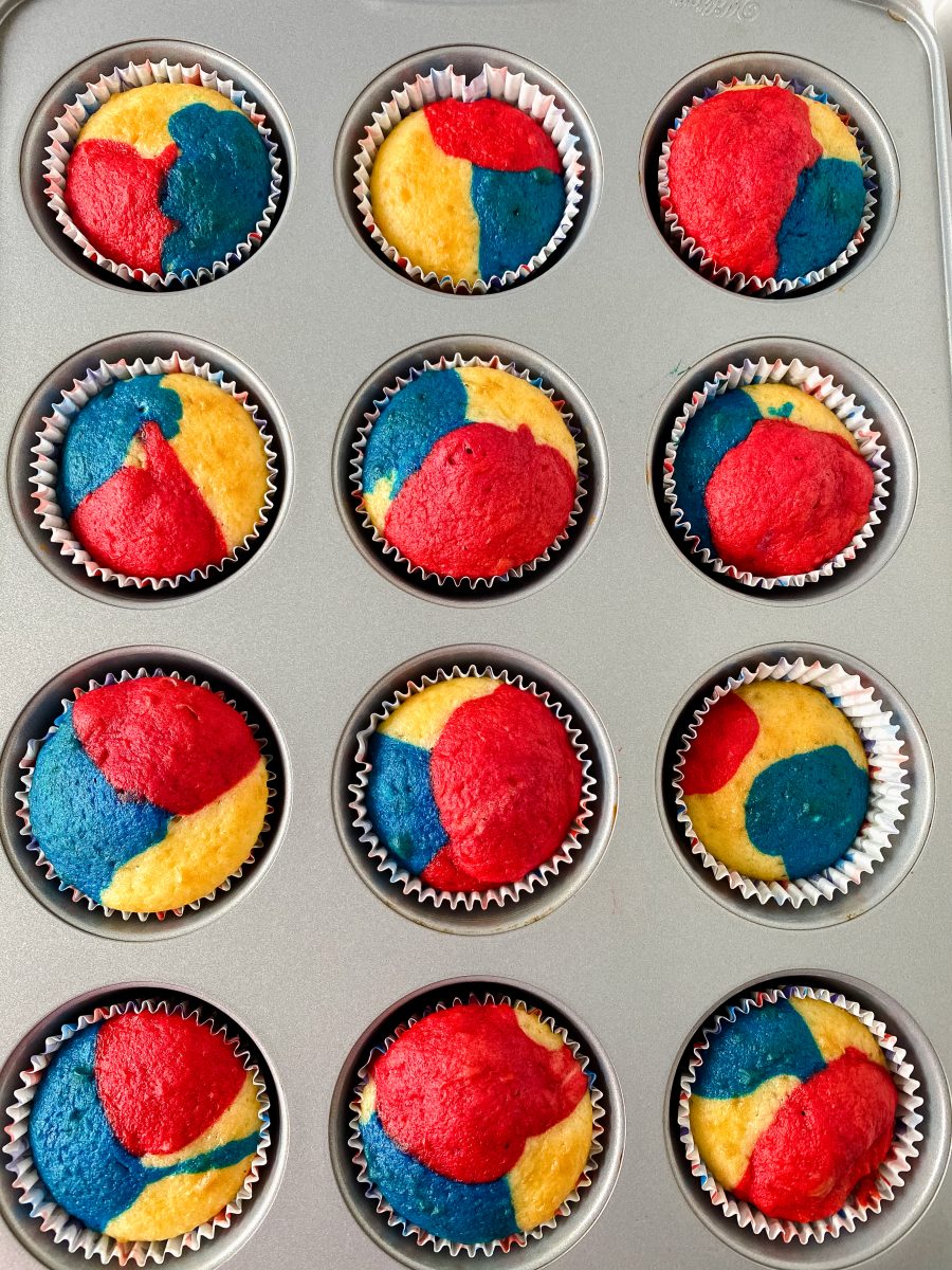 Top-down view of baked red, white, and blue cupcakes in a cupcake pan - Hostess At Heart