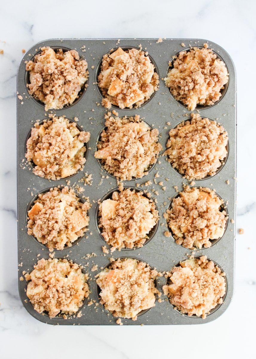 Muffins topped with streusel in a cupcake pan - Hostess At Heart