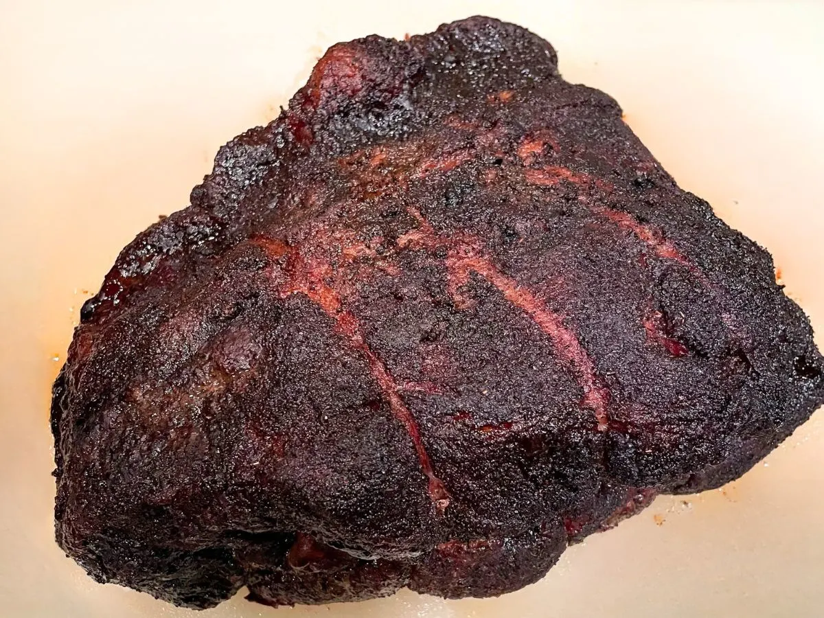A grilled brisket with a beautiful dark bark. Hostess At Heart