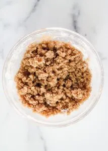 Top down view of a bowl filled with brown sugar cinnamon streusel topping - Hostess At Heart
