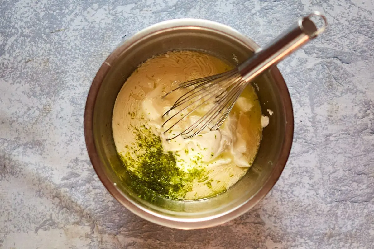 A mixer bowl filled with yogurt, zested lime, sweetened condensed milk, and lime juice - Hostess At Heart