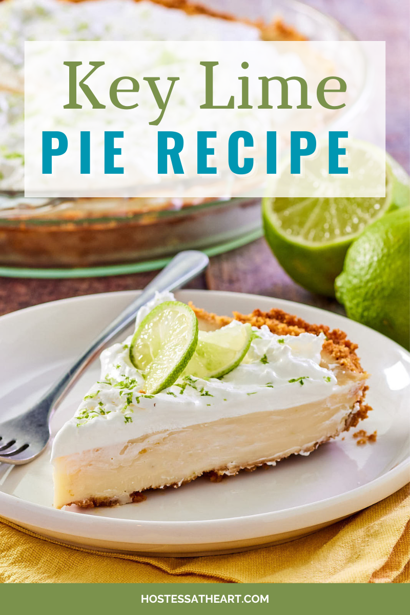 Image for Pinterest featuring a sideview of a slice of Key lime Pie in a graham cracker crust and garnished with lime zest. Hostess At Heart