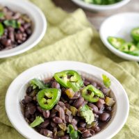 Sideview of a bowl of Cuban Black Beans made from scratch - Hostess At Heart