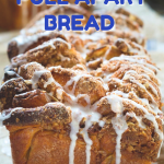 Cinnamon Apple Pull-Apart Bread topped with Streusel and dripping sugar glaze. Hostess At Heart