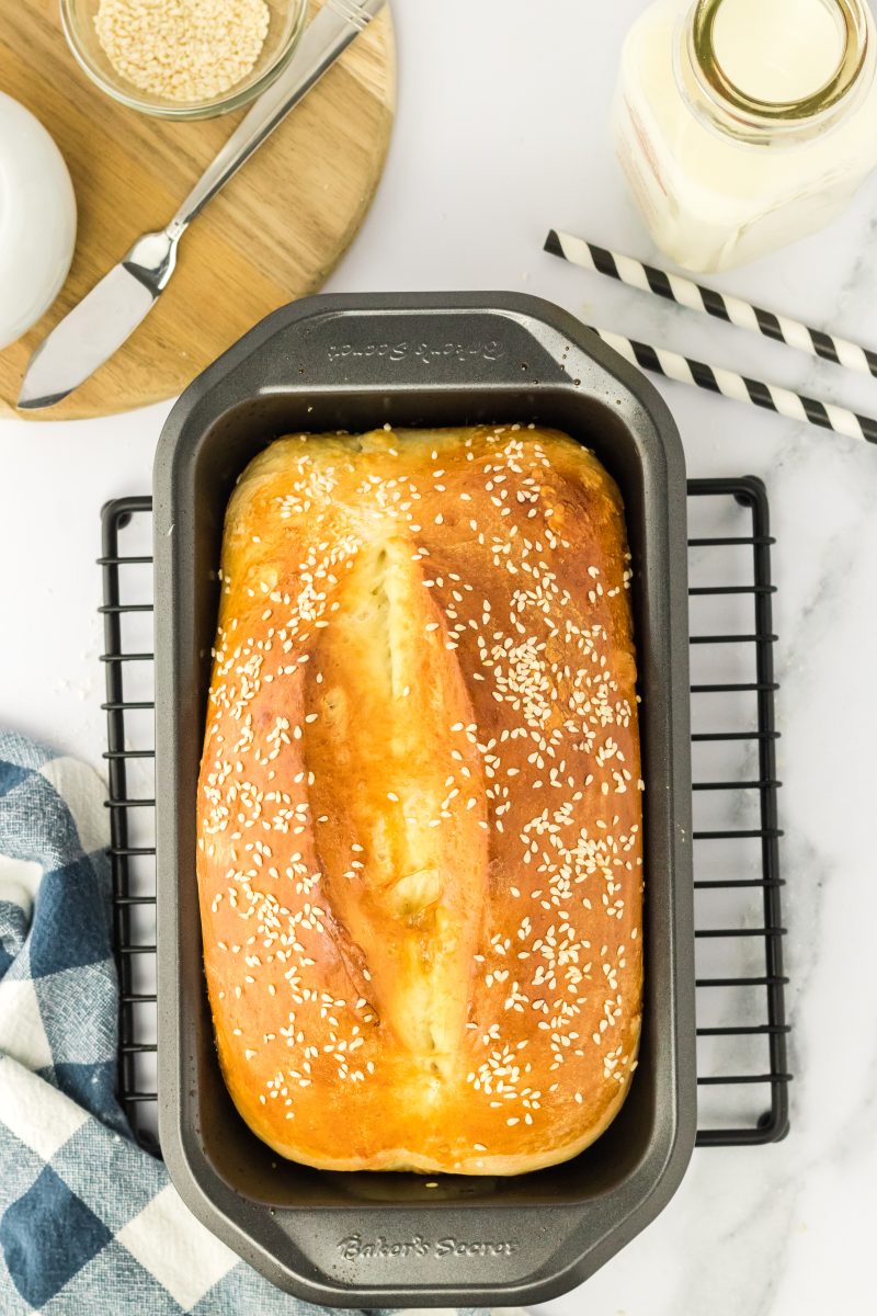 Top down view of sesame seed bread still in the pan.