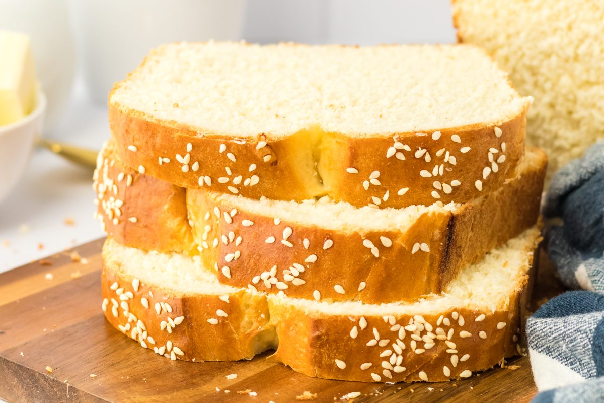 Slices laying on their side to show the close up view of the top of the bread with sesame seeds.