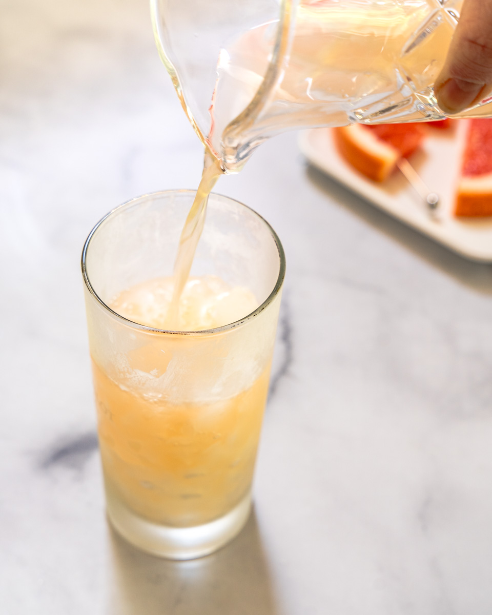 Grapefruit juice poured into a chilled glass - Hostess At Heart