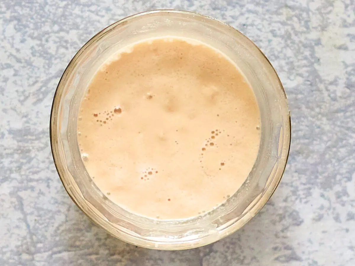 Top down view of activated bubbly yeast in a bowl - Hostess At Heart